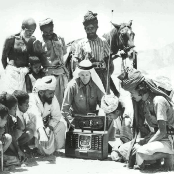 A Zenith Trans-Oceanic radio drawing a crowd in the field