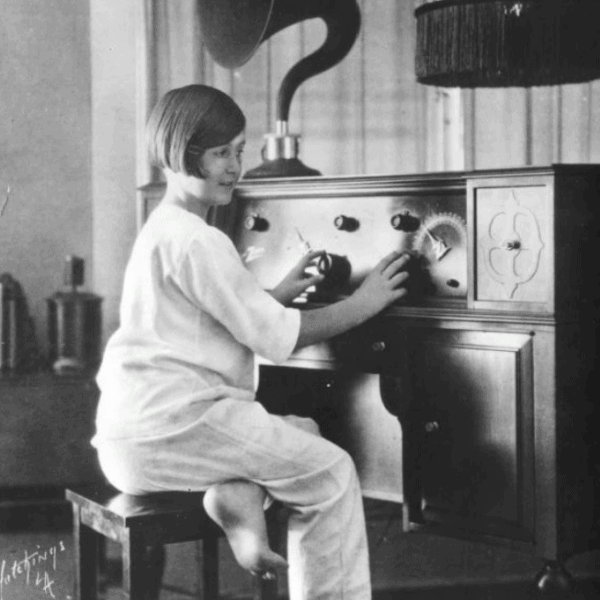 Child tuning a Zenith console radio, 1920s